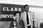 Two people pose with their trophies, 1982 by Clark University