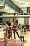Action shot of JV basketball game, circa 1980s-1990s by Clark University