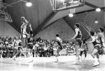 Action shot of men's basketball game [2], circa 1984-1986 by Clark University