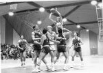 Action shot of men's basketball game [5], circa 1984-1986 by Clark University