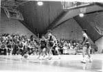 Action shot of men's basketball game [8], circa 1984-1986 by Clark University