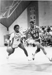 Action shot of men's basketball game [10], circa 1984-1986 by Clark University