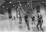 Action shot of men's basketball game [11], circa 1984-1986 by Clark University