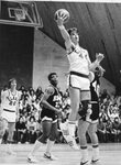 Action shot of men's basketball game, 1979 by Clark University