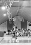 Action shot of men's basketball game [23], 1984 by Clark University