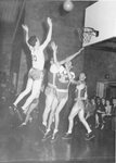 Action shot of men's basketball game [30], circa 1950s by Clark University