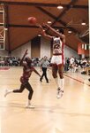 Action shot of men's basketball game [25], 1984 by Clark University