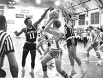 Action shot of men's basketball game [33], circa 1970s by Clark University