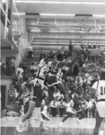 Action shot of men's basketball game [42], circa 1987-1988 by Clark University