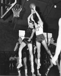 Action shot of men's basketball game [16], 1955 by Clark University