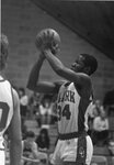 Tyrone Hicks takes a shot during men's basketball game, circa 1980s by Clark University