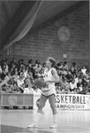 Women’s basketball team member takes free throw shot, circa 1980s by Clark University