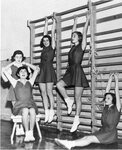Women’s basketball team stretch, circa 1940s-1950s by Clark University