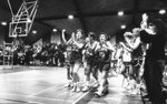 Women’s basketball team and audience celebrate, circa 1980s by Clark University