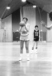 Women’s basketball team member takes a free throw shot, 1985 by Clark University and Joe Marais