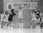 Women’s basketball team in the middle of a game, 1983 by Clark University
