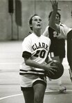 Women’s basketball team member with the ball during a game, 1979 by Clark University
