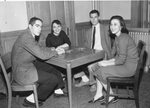 Four students play bridge, circa 1950s by Clark University