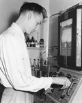 Student uses a laboratory machine [2], date unknown by Clark University
