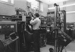 Student uses a laboratory machine [3], date unknown by Clark University