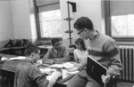 Students working together on an assignment, circa 1950s-1960s by Clark University