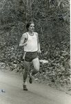 Men’s cross country team member runs in meet [4], circa 1970s-1980s by Clark University