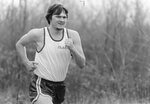 Men’s cross country team member runs in meet [5], circa 1970s-1980s by Clark University