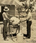 [068] Charles Mansur and Albert Kisk filling 15-liter container of liquid oxygen from 50-liter container, 1930 by Esther C. Goddard