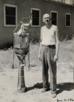 [088] Robert Goddard with 12" diameter rocket motor, 1932 by Esther C. Goddard